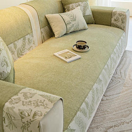 Botanical Border Chenille Sofa Cover shown on a sofa