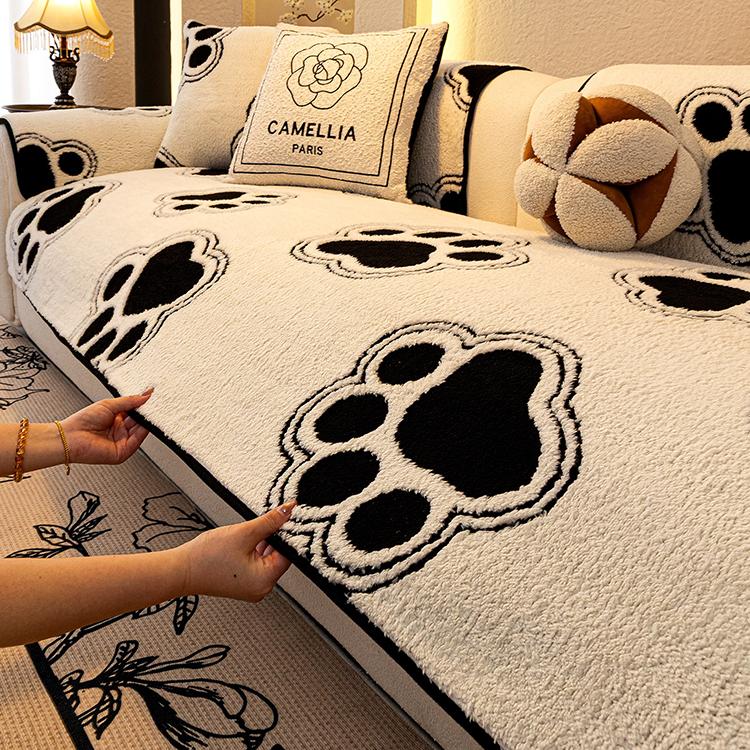 Cozy Paw Print Plush Non-Slip Couch Cover styled on a sofa
