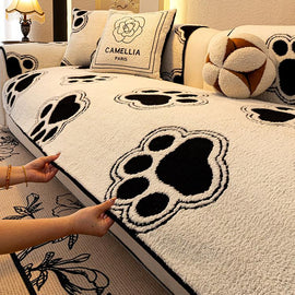 Cozy Paw Print Plush Non-Slip Couch Cover styled on a sofa