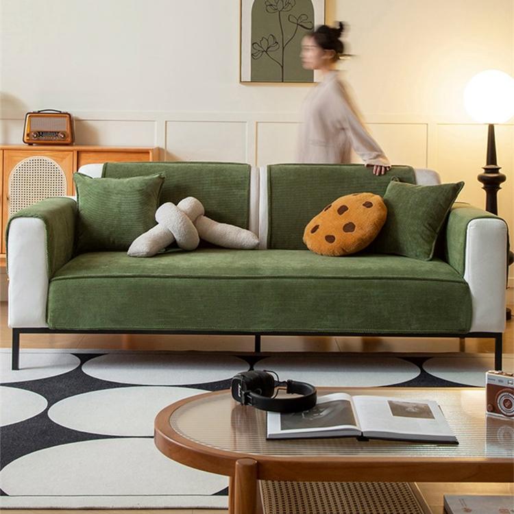 Green corduroy covers arranged across a sofa — gsft-9053 Imagen principal del producto