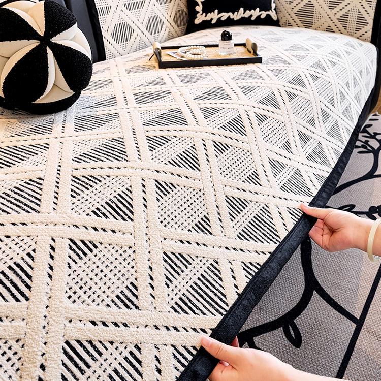 Lifting the geometric cover from the sofa seat — gsft-9055