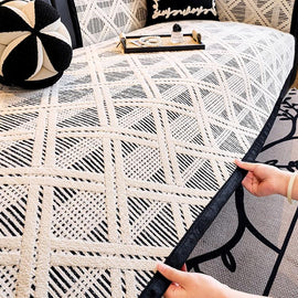Lifting the geometric cover from the sofa seat — gsft-9055