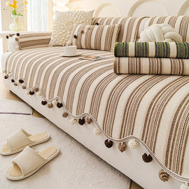 Decorative Stripe & Scalloped Chenille Couch Cover styled on a sofa