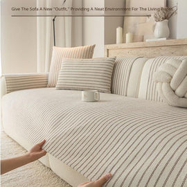 Lifting the pinstripe cover from the sofa seat — gsft-9058
