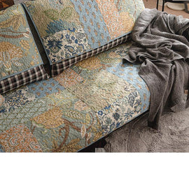 Quilted floral patchwork across the sofa seat — gsft-9060