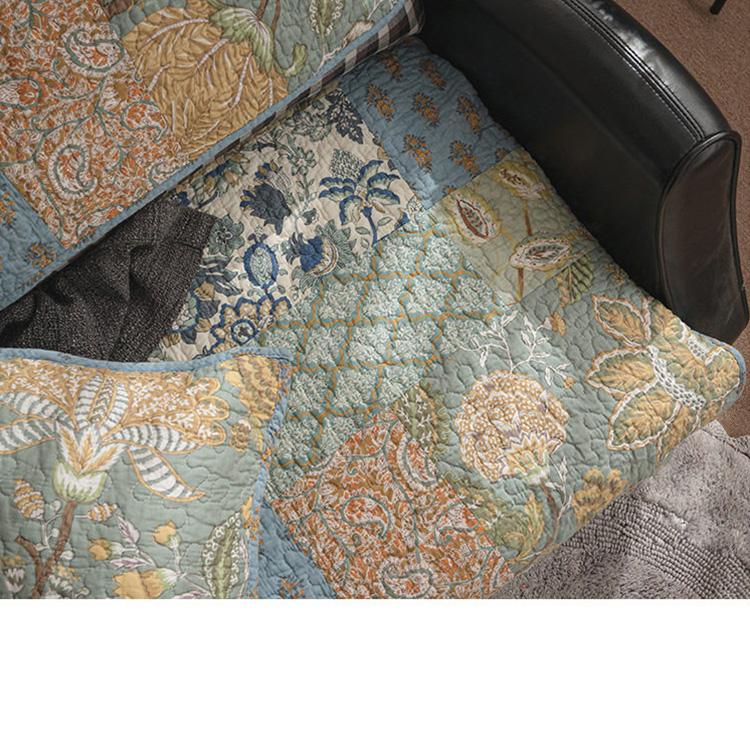 Vintage botanical patchwork on a sofa seat — gsft-9060