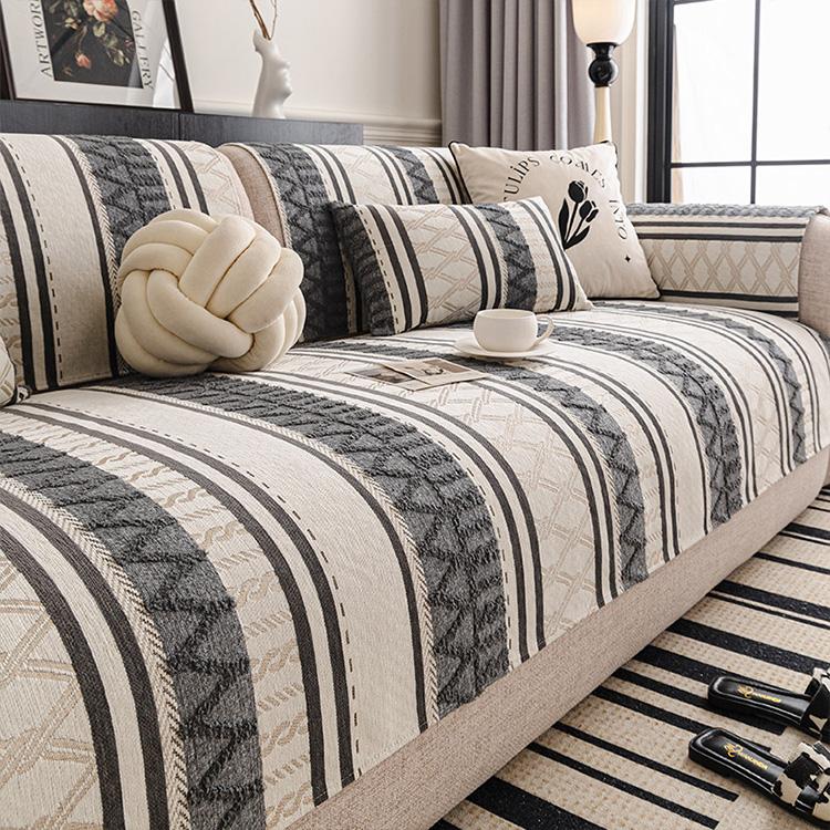 Tribal Geometric Stripe Chenille Sofa Cover styled on a sofa