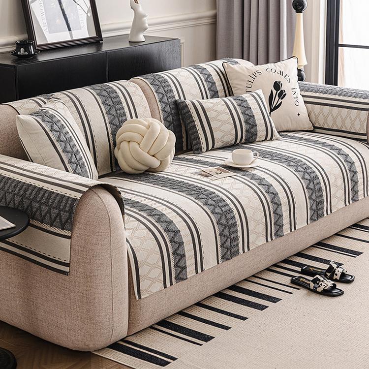 Geometric stripe cover draped across a sofa — gsft-9061