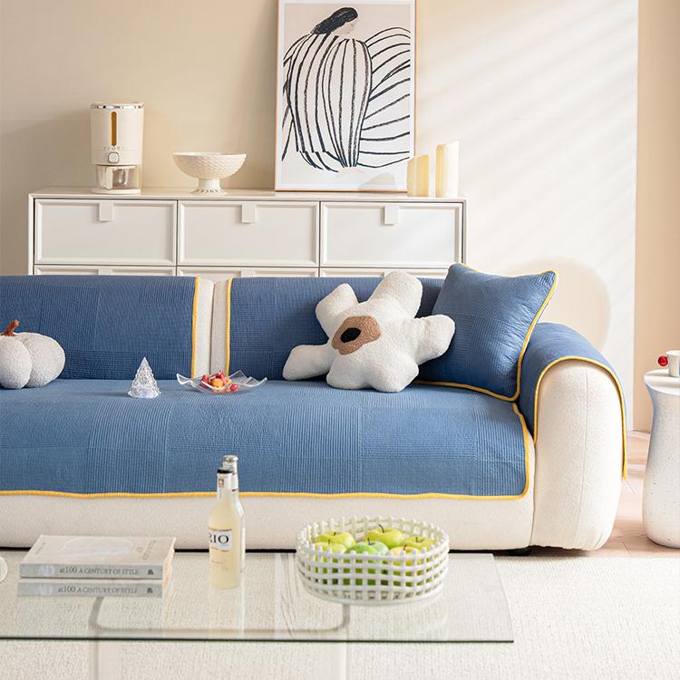 Front view of the blue quilted sofa cover — gsft-9065