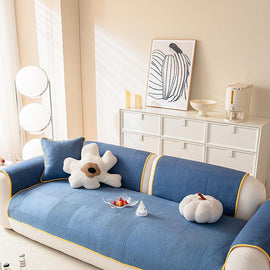 Blue quilted cover across a sofa seat — gsft-9065