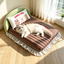 Dark brown striped cat sofa bed with green headboard and supportive pillow