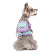 Purple harness backpack fitted securely across a dog's back