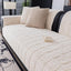 Beige ribbed plush fleece modular couch cover shown on a sofa