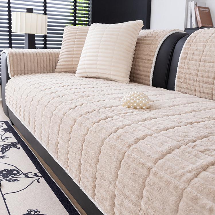 Coffee ribbed plush fleece modular couch cover shown on a sofa