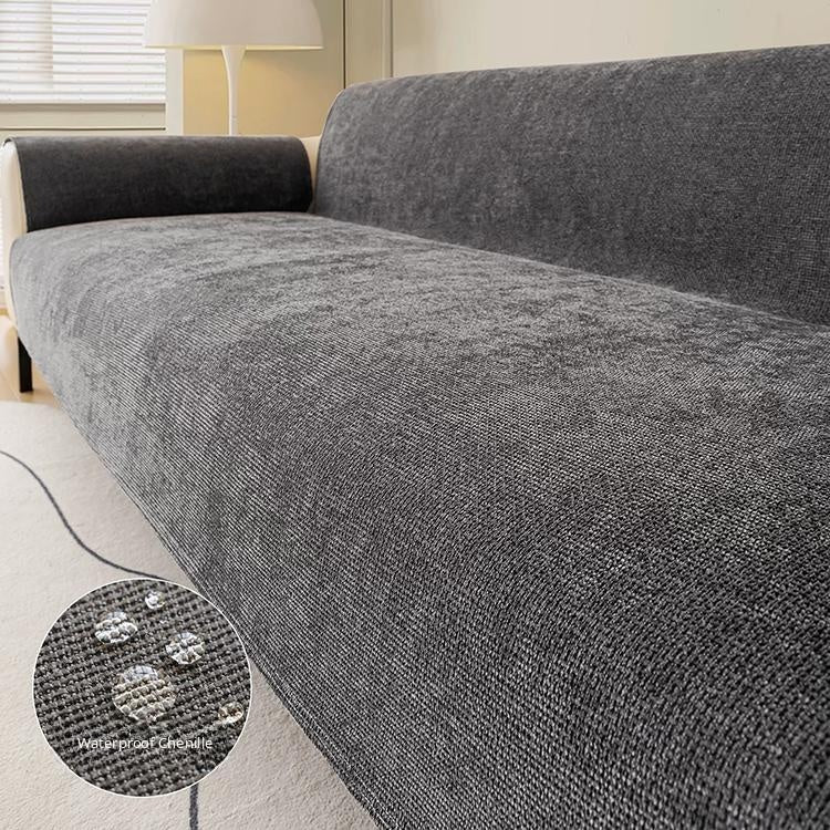 Dark gray water-resistant chenille full sofa cover shown on a sofa