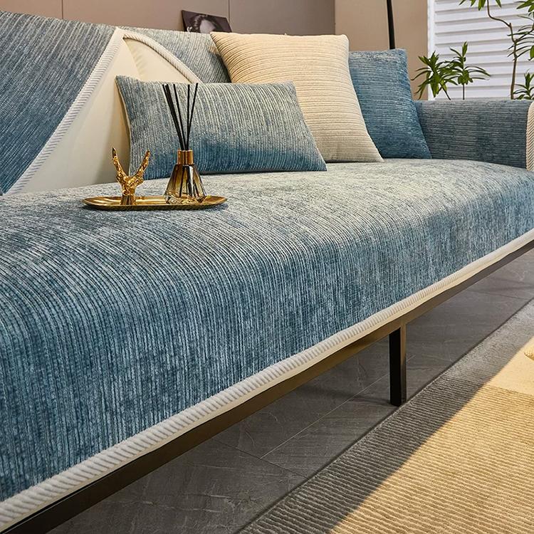 Blue ribbed jacquard chenille modular couch cover shown on a sofa