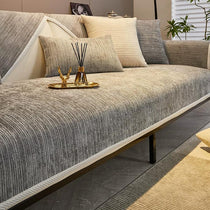 Light gray ribbed jacquard chenille modular couch cover shown on a sofa