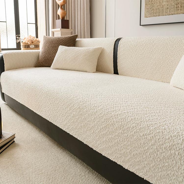 Beige boucle-style chenille modular couch cover shown on a sofa