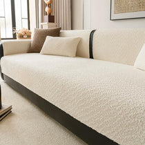 Beige boucle-style chenille modular couch cover shown on a sofa