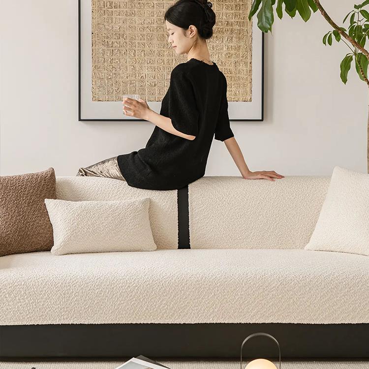 Cloud-Bouclé Chenille Modular Couch Cover flexible fabric draped over a sofa seat