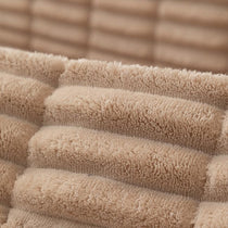 Plush Ribbed Fleece Couch Cover detail showing the cover draped across a sofa