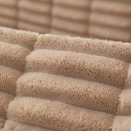 Plush Ribbed Fleece Couch Cover detail showing the cover draped across a sofa