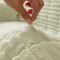 Plush Ribbed Fleece Couch Cover detail showing the cover draped across a sofa
