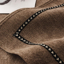 Contrast-Trim Chenille Couch Cover detail showing the cover fitted on a modern sofa