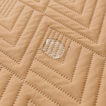 Water-Resistant Geometric Quilted Couch Cover detail showing the coordinated color selection