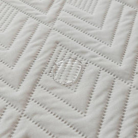 Water-Resistant Geometric Quilted Couch Cover detail showing the dimensional quilt stitching