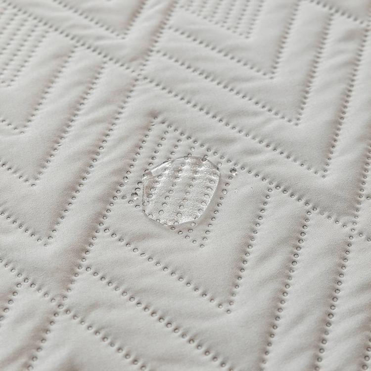 Water-Resistant Geometric Quilted Couch Cover detail showing the dimensional quilt stitching