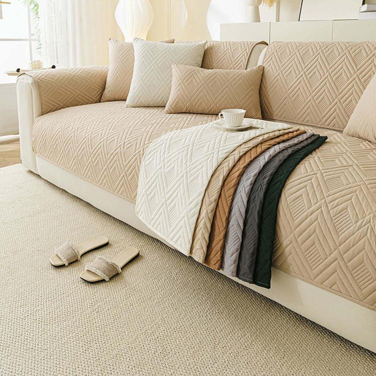 Water-Resistant Geometric Quilted Couch Cover styled across a sofa Main image