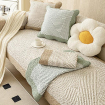 Reversible Patterned Cotton Couch Cover detail showing a coordinated sofa-and-cushion arrangement