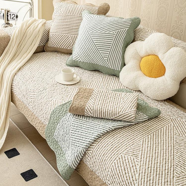 Reversible Patterned Cotton Couch Cover detail showing a coordinated sofa-and-cushion arrangement