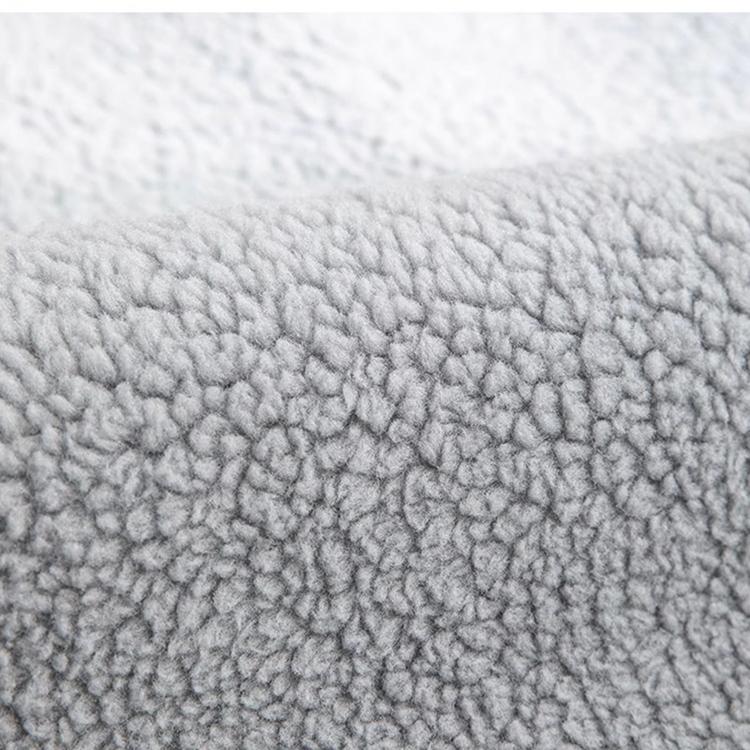 Cozy Faux Sherpa Couch Cover detail showing the finished edge and accent label