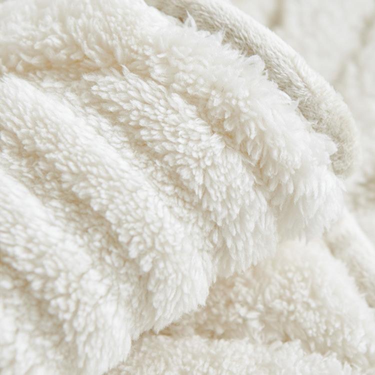 Sculpted Wave Plush Couch Cover detail showing the coordinated neutral palette