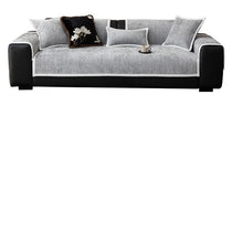 Gray modular chenille cover arranged across a sofa