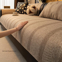Hand smoothing the textured sofa cover
