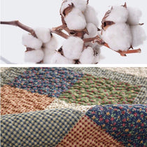 Cotton fibers and quilted patchwork texture