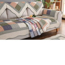 Folded patchwork color options on a sofa