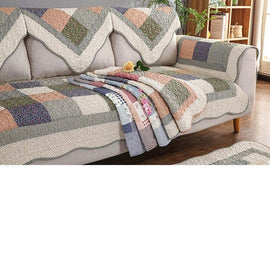 Folded patchwork color options on a sofa