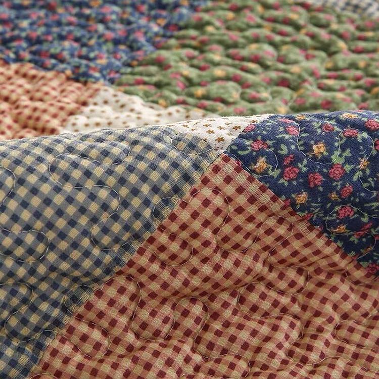 Layered patchwork patterns on a sofa