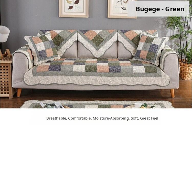 Green patchwork cover styled across a sofa