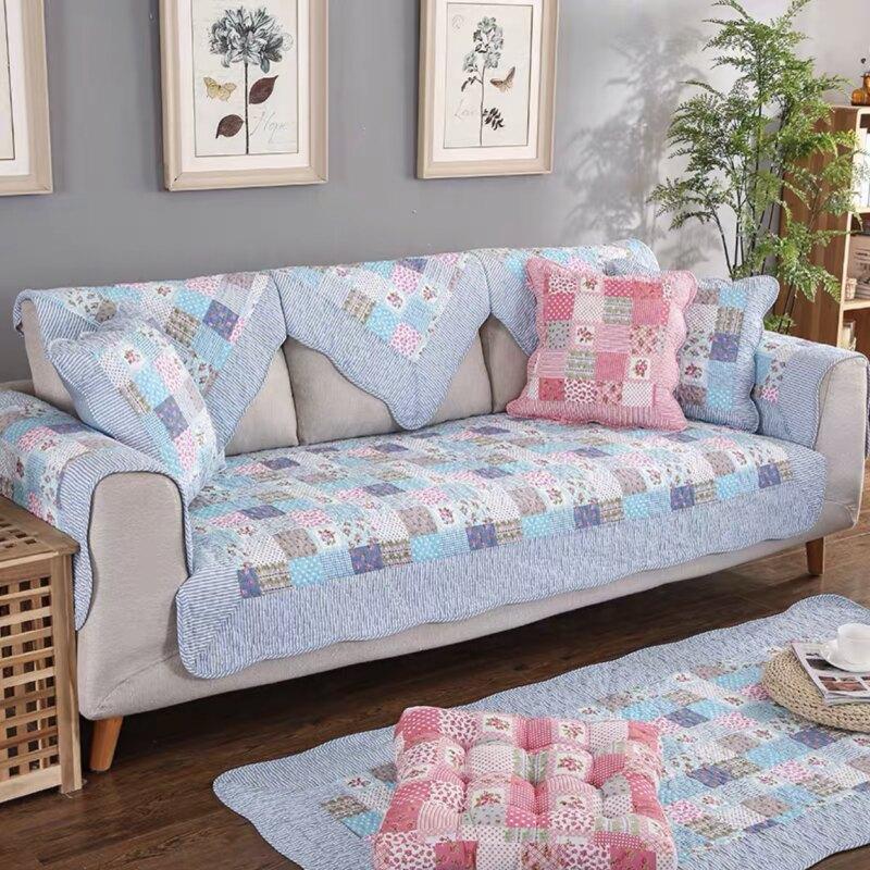 Blue-gray patchwork cover styled across a sofa