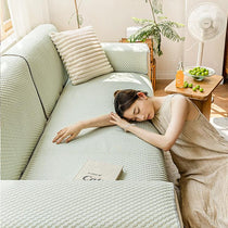 Green cooling couch cover styled for summer lounging