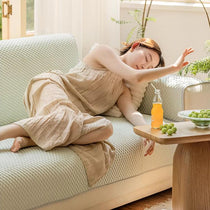 Woman relaxing on the cooling sofa cover