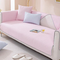 Pink honeycomb couch cover on a sofa