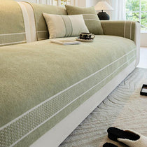 Green cover protecting the sofa seat