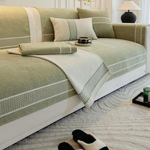 Two-tone couch cover draped over a sofa
