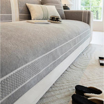 Gray couch cover edge and woven border